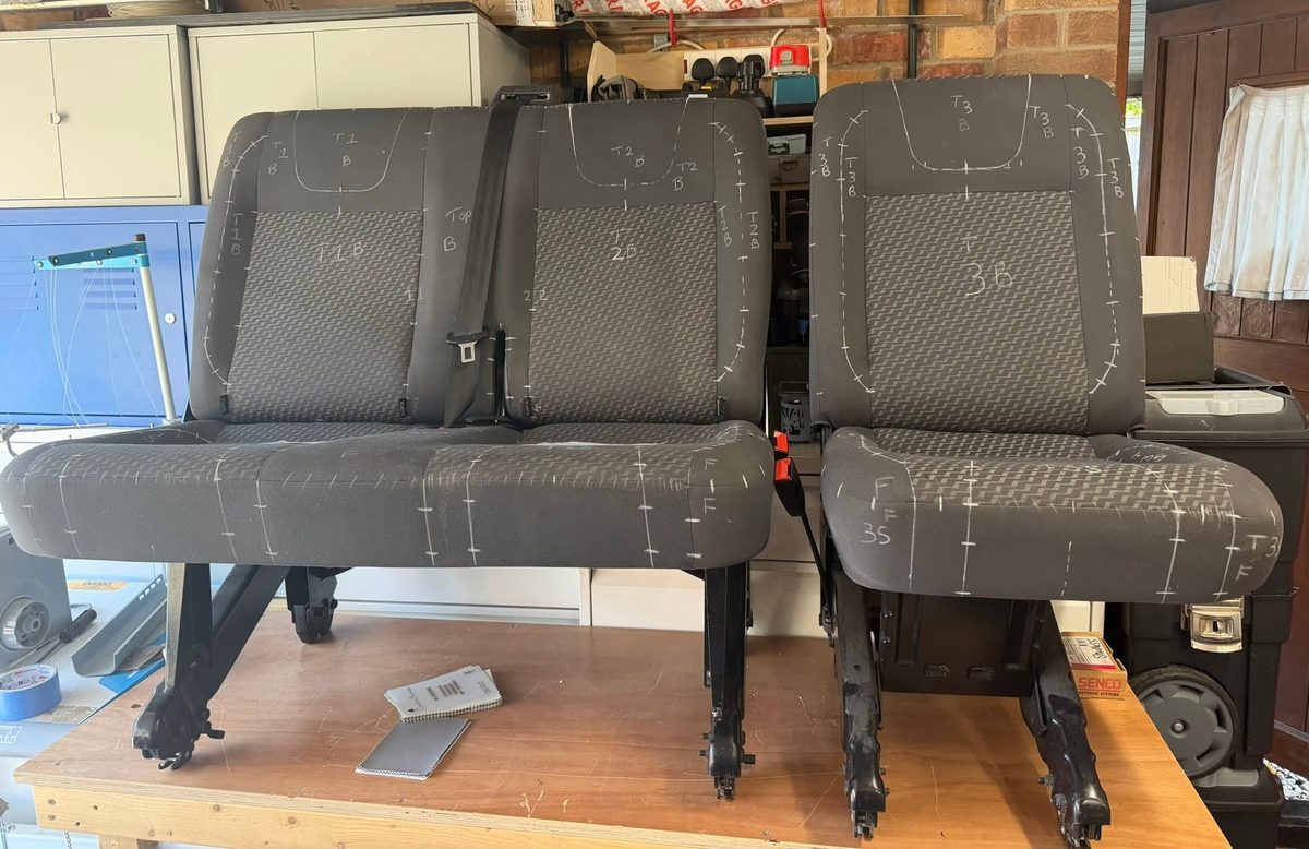 Seats marked up in chalk in the workshop