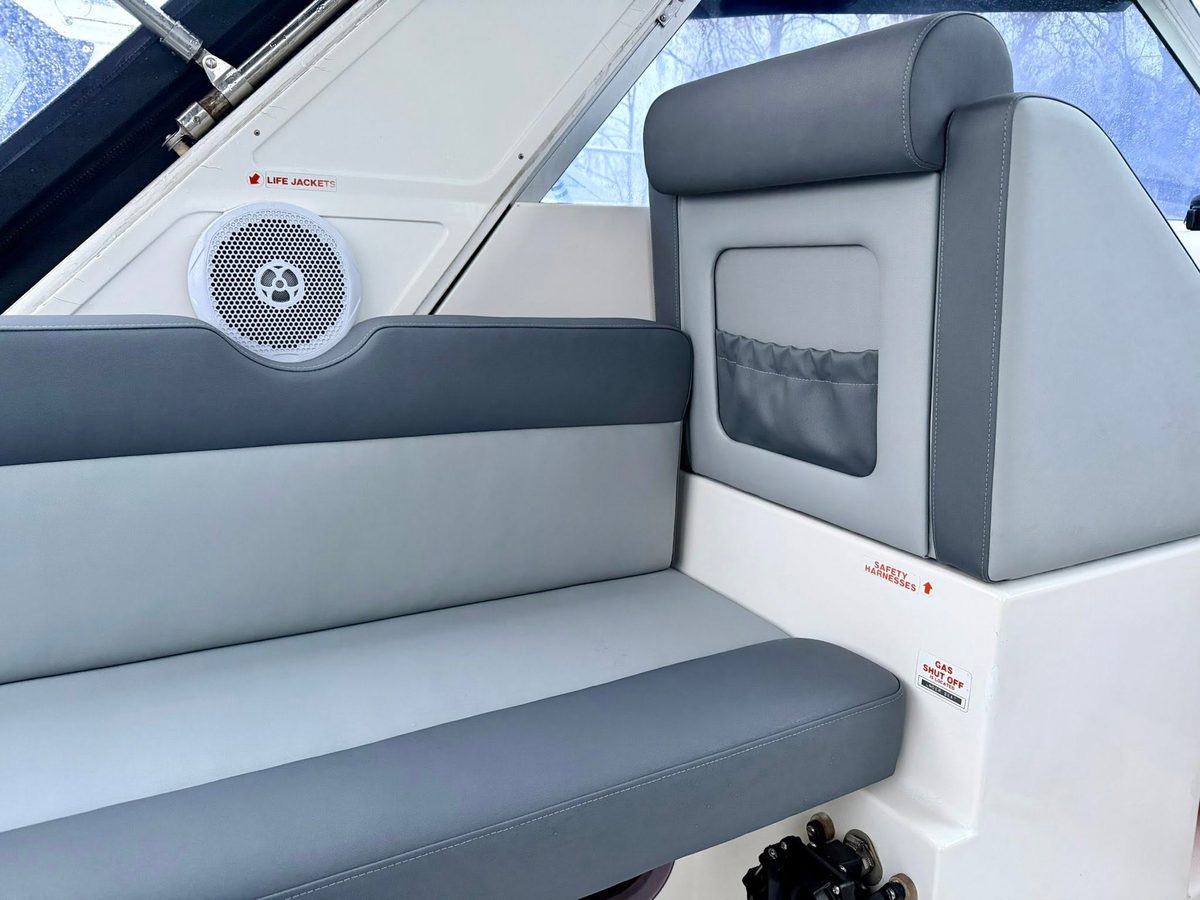 Grey marine vinyl seating detail with speaker cut-out